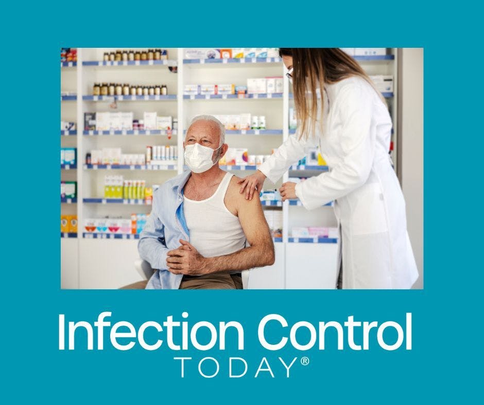 A nurse giving a vaccine to an older man at a pharmacy.  (Adobe Stock 488549113 by dusanpetkovic1)