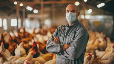 Bird flu virus outbreak, avian influenza, farmer with chicken.  (Adobe Stock 830193791 by Berit Kessler) 